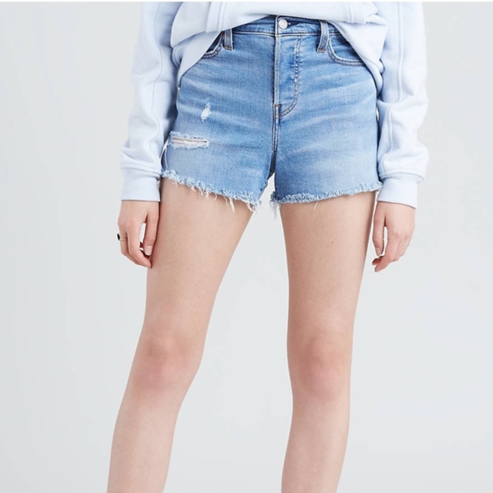 Levi’s High Rise Distressed Light Wash Denim Shorts
